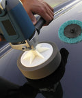Polisher with 35 Piece Sanding Disc Polishing Kit With Handle Aluminum Oxide Abrasive Wheels on glossy surface