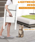 Person carrying Three Step Aluminum Folding Ladder with wide anti-slip pedals, ultra lightweight, compact design, home setting.