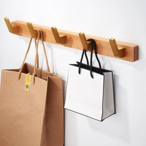 No Fuss Brass Wall Mount Coat Hooks Durable Entryway Hanger Rack with bags hanging on wooden wall mount in hallway.
