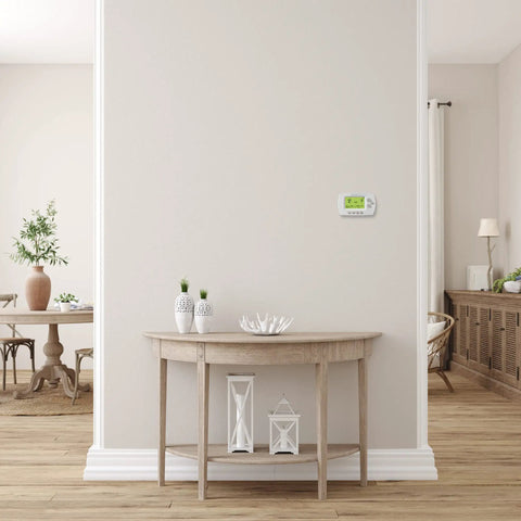 Smart 7-Day Wi-Fi Programmable Thermostat With Energy Star Rating on wall in modern living room, renewed condition
