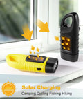 Four Pack Hand Crank Solar Powered Flashlights With Rechargeable LED Lighting Emergency Torches in yellow and black charging by window