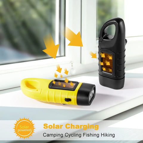 Four Pack Hand Crank Solar Powered Flashlights With Rechargeable LED Lighting Emergency Torches in yellow and black charging by window