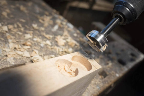 Kickstart Your Projects With This Badass Forstner Drill Bit Set Featuring High Speed Steel Construction And Killer Serrated Cutters For Knockout Precision Wood Drilling Smooth Operation And Built Like A Tank Durability In Five Piece Kit. Close-up of Forstner drill bit in wood, showing serrated cutter and clean hole.