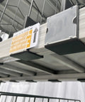 Twenty Pack Heavy Duty Wire Shelf Dividers With Double Buckle Clips For Store Fixtures And Library Shelving Includes Erasable Price Labels, showing clips and labels on a wire shelf.