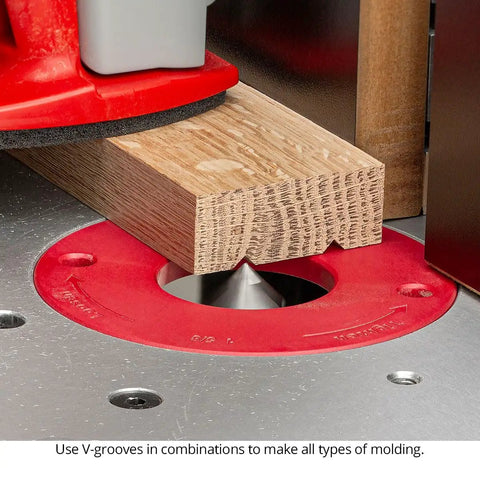 7 Piece 90 Degree V Groove Router Bit Set Featuring Premium Carbide Cutters In Quarter And Half Inch Shanks For Engraving Lettering Miter Joinery American Made Kit That Cuts Like Butter On Cnc Desktop Or Handheld Routers, in use on oak wood.