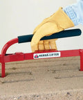 Versa-Lok Versa Lifter Standard Tool For Easy And Safe Handling Of Block Walls equipped with durable steel grip lifting concrete block.
