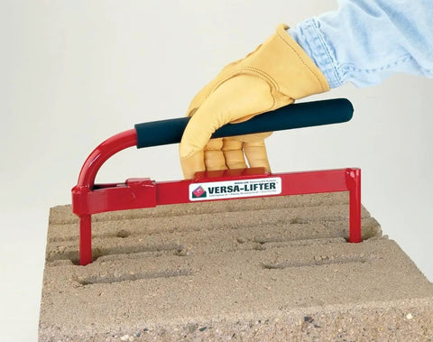 Versa-Lok Versa Lifter Standard Tool For Easy And Safe Handling Of Block Walls equipped with durable steel grip lifting concrete block.