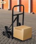Heavy Duty Stair Climbing Dolly With Ten Wheels For No Sweat Moving, 551 Pound Flat Ground Weight Limit, Foldable Steel Cargo Cart handling a cardboard box.