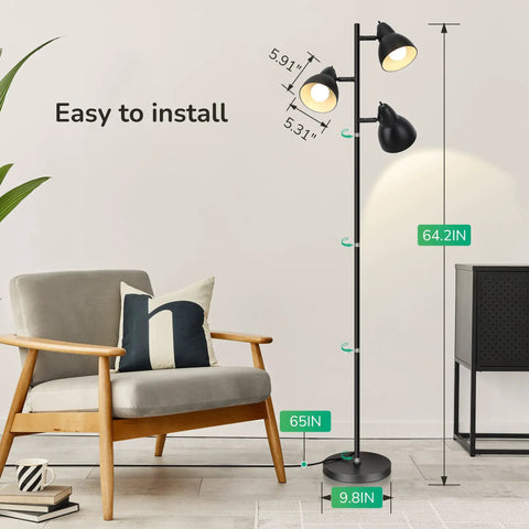 Three Adjustable Rotating Heads Go-To Tree Floor Lamp In Black Industrial Rustic Style pictured next to a chair with dimensions shown.