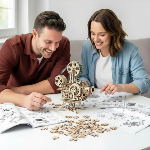 Vitascope 3D Wooden Puzzle Vintage Film Projector Model Kit With Hand Crank 183 Piece Wood Building Set For Adults And Teens Ideal Gift For Hobbyists And Movie Buffs, two people assembling it