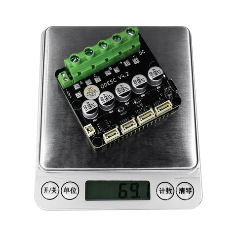 ODESC V4.2 24V Single Drive High Current High Precision Brushless Servo Motor Controller on digital scale showing 69.1 grams