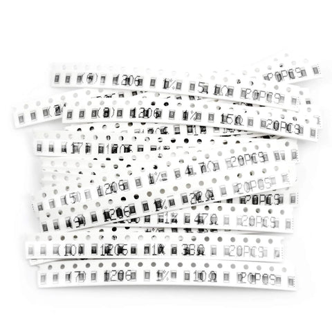 Front view of white carrier tape with multiple 1206 SMD resistors on perforated strips