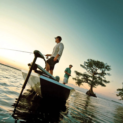 Edge Bow Mount Electric Trolling Motor With Foot Pedal Control for Freshwater Boats 70 lb thrust on a lake at sunset