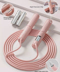 Pink Cordless Jump Rope With Counter And LCD Display, 2 In 1 Ropeless Jump Rope With Ball Weighted Design, shown with cords and metal weights