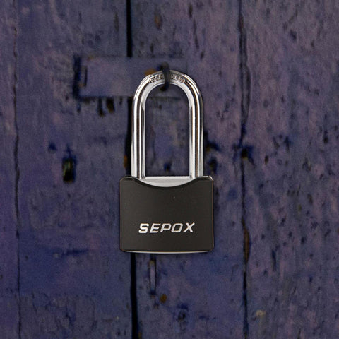 All Weather Outdoor Padlock Set Keyed Alike, black cover, solid steel lock on wooden background.