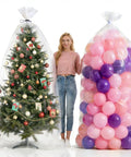 Huge Balloon Storage Bags Pack Of Four Transparent Giant Bags 59 By 98 Inches And 47 By 59 Inches holding tree and balloons