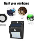 Solar Motion Sensor Outdoor Lights 30 LED 4 Pack With Motion Activated Security Lighting No Fuss Solar Powered Exterior Wall And Gutter Sconce Lamps For Home Safety Weatherproof Black, showing light features and solar panel.