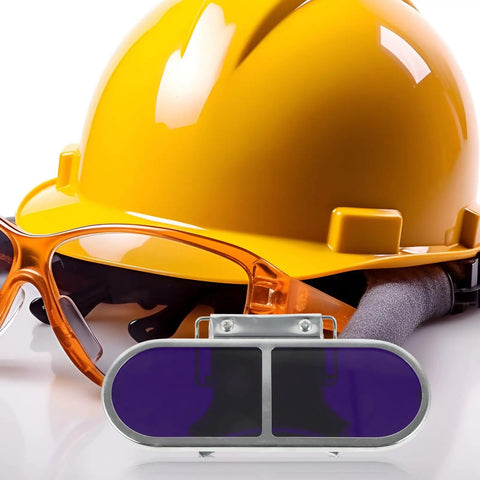 Tough As Nails Metal Welding Goggles With Flip Up Lens and Secure Screw Clip For High Intensity Flame Shielding and Soldering Rock Solid Industrial Safety Eyewear For All Day Grind with yellow hard hat and orange safety glasses.