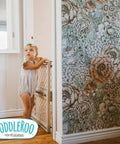 Top Shelf Adjustable Baby Gate For Kids And Toddlers Heavy Duty Plastic Child Safety Barrier with toddler near doorway.