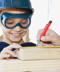 Smiling girl wearing safety gear using a Rock Solid 2.8mm Carpenter Pencil Lead Refills 36 Piece Bulk Pack to mark wood.