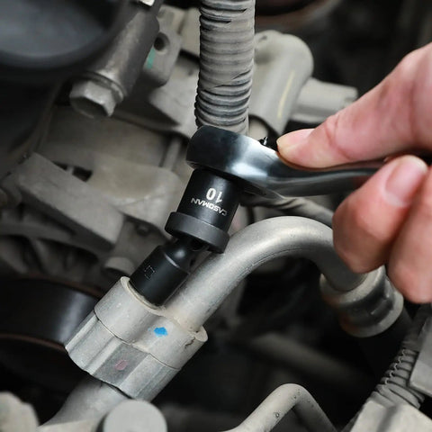 Using a Heavy Duty Eighty Six Piece One Quarter Inch Drive Impact Socket Set With Adapters U Joint Extensions on auto engine