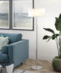Two Light Floor Lamp With Fabric Shade In Cool Gray And Polished Nickel For Home Office Bedroom And Living Room 61 Inch Tall Modern Floor Lamp Perfect For Reading Nooks And Sofas, positioned next to a sofa in a modern living room.