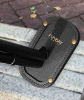 Magnetic Leather Barrel Rest for Shotguns, black leather with brass accents and visible logo, for Sporting Clays, Trap, Skeet, Five Stand.