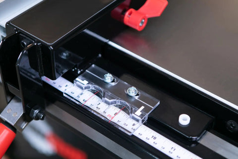Close-up view of Advanced T Glide Rip Fence design with measuring scale, dovetail slots, and quick accessory mount for cabinet saw.