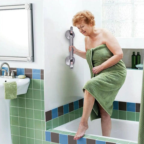 Woman using 19 Inch Shower Suction Grab Bar With Tool Free Install Portable Bath Handle Heavy Duty Grip Rapid Release Suction Cup No Drill Safety Bar For Bathroom Supports Up To 300 Lb Great For Seniors in bathroom.