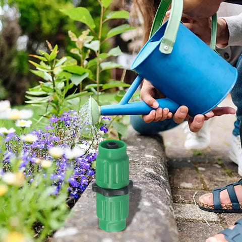 Fix Your Leaky Hoses Like A Pro With This Awesome Expandable Garden Hose Repair Kit For 5/8 And 3/4 Inch Sizes That Lets You Quick Fix Any Damaged Sections Fast Without Calling A Plumber Today. Green plastic hose repair connector in garden watering use