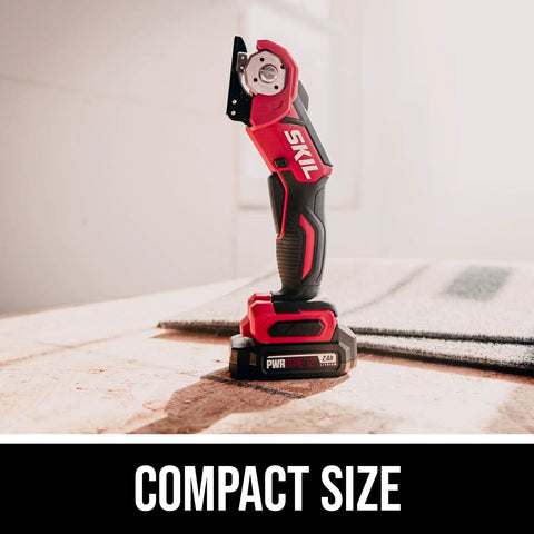 PWR Core 12 12V Multi Cutter Kit with 2.0Ah battery and charger on wooden surface, highlighting compact size and design.