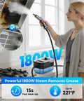 Heavy Duty Handheld Steam Cleaner For Home And Auto, No Fuss Design With Snappy 15 Second Heat Up, Roomy 1600ml Tank, shows a woman using it to clean grease.