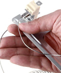 Close-up of hand holding Dryer Heating Element Upgrade Kit With 3392519 Thermal Fuse 279973 Thermostat And 279816 Element 8544771.
