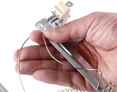 Close-up of hand holding Dryer Heating Element Upgrade Kit With 3392519 Thermal Fuse 279973 Thermostat And 279816 Element 8544771.