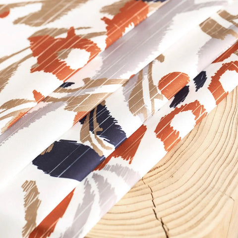 Close-up of Privacy Boho Curtains 84 Inches Long 2 Panels Set Orange Brown Light Filtering Drapes with floral pattern on fabric.