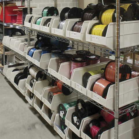 Heavy Duty Plastic Stacking Storage Bins In Beige Featuring A Six Pack Bundle With Reinforced Structural Frames For Rock Solid Load Support And Top Shelf Garage Organization System on metal racks filled with colored spools.