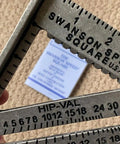 Close-up of 7 Inch Speed Square Blue For Framing And Woodworking With Multi Gradation Markings on Hip Valley scale.