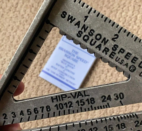 Close-up of 7 Inch Speed Square Blue For Framing And Woodworking With Multi Gradation Markings on Hip Valley scale.