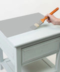 Hand painting table with Chalked All In One Ultra Matte Paint In Aged Gray, One Coat Coverage, No Primer, 30 Oz Quick Dry Time