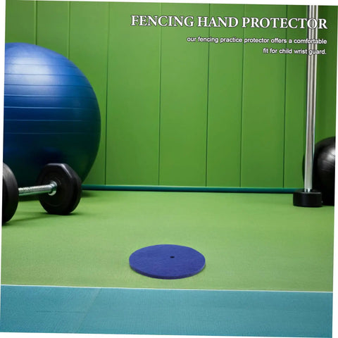 Blue Wool Felt Fencing Hand Guard Pads on green exercise mat, surrounded by fitness equipment.