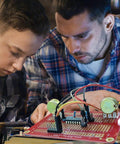 Two people soldering wires on Gold Plated Solderable Breadboard Proto Board For Arduino And Raspberry Pi Projects, Dope DIY PCB Kit