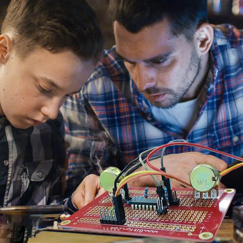 Two people soldering wires on Gold Plated Solderable Breadboard Proto Board For Arduino And Raspberry Pi Projects, Dope DIY PCB Kit