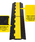 Two Channel Rubber Cable Ramp Protector And Cord Cover For Cables And Hoses Rugged Heavy Duty Traffic Ramp For Driveways And Outdoors Ideal For Asphalt Concrete Gravel Surfaces 1 Pack showing surface texture and high visibility features.