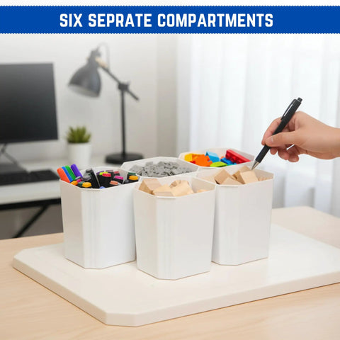 Desk organizer with six separate compartments holding markers, clips, and blocks in a home office setting.