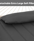 Close-up of a dark gray two layer quilted polyester hammock bed with detachable pillow, Standing Patio Hammock With Canopy And Foldable Stand