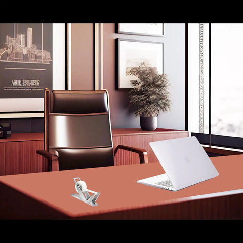 Modern Art Tape Dispenser Stainless Steel Silver on an office desk with a laptop, in a stylish office setting.