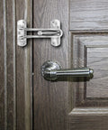 4 Pack Swing Bar Door Guard Set For Inside Doors, Built Tough Latch Guard Lock Reinforcement, shown in zinc alloy on wooden door