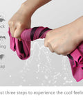Hands wringing a pink 4 Pack Ice Cooling Towels 40x12 Inches For Neck And Face Ultra Soft Microfiber Chilly Towel, water dripping.
