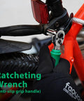 Person using 39 Piece Ratcheting Wrench Set With Mini Sockets Magnetic Screwdrivers Power Bits Universal Joints Spinner Extensions And A Handy Portable Storage Box For Mechanics And Do It Yourself Enthusiasts on a bicycle