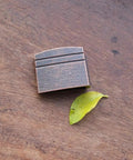New Dope Habaki Collar Alloy Or Copper 01 22 Fit Katana Wakizashi Tanto on wooden surface with leaf